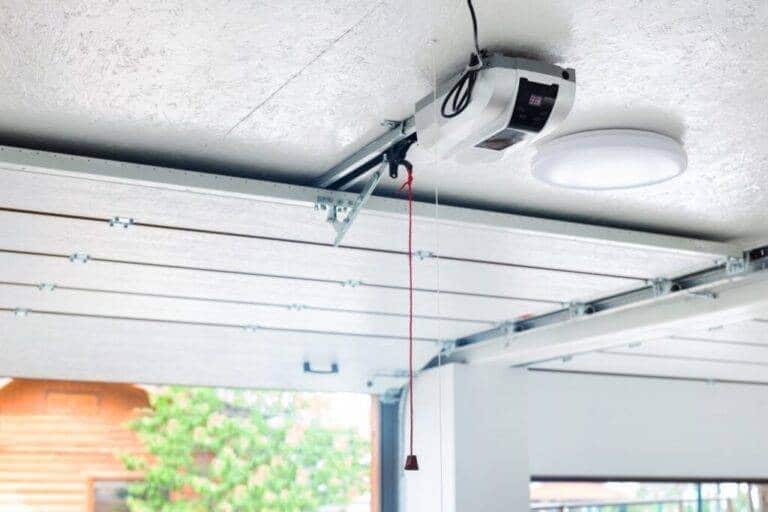 Garage door technician at work on a residential garage door